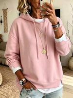 Casual White Hooded Sweatshirt With Color-block Detailing And A Layered-look Design.
