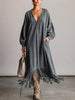 Washed, Distressed, Loose-fit Denim Dress Featuring A V-neck, Long Lantern Sleeves, And A Fringed Hem