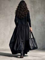 Casual Long Dress Featuring A High-neck Knit Bodice And Woven Skirt Panel.