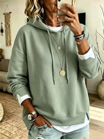 Casual White Hooded Sweatshirt With Color-block Detailing And A Layered-look Design.