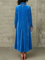 High-neck Velvet Maxi Skirt With An Asymmetrical Hem And Diagonal Button Detail